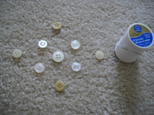 Sewing buttons with thread.
